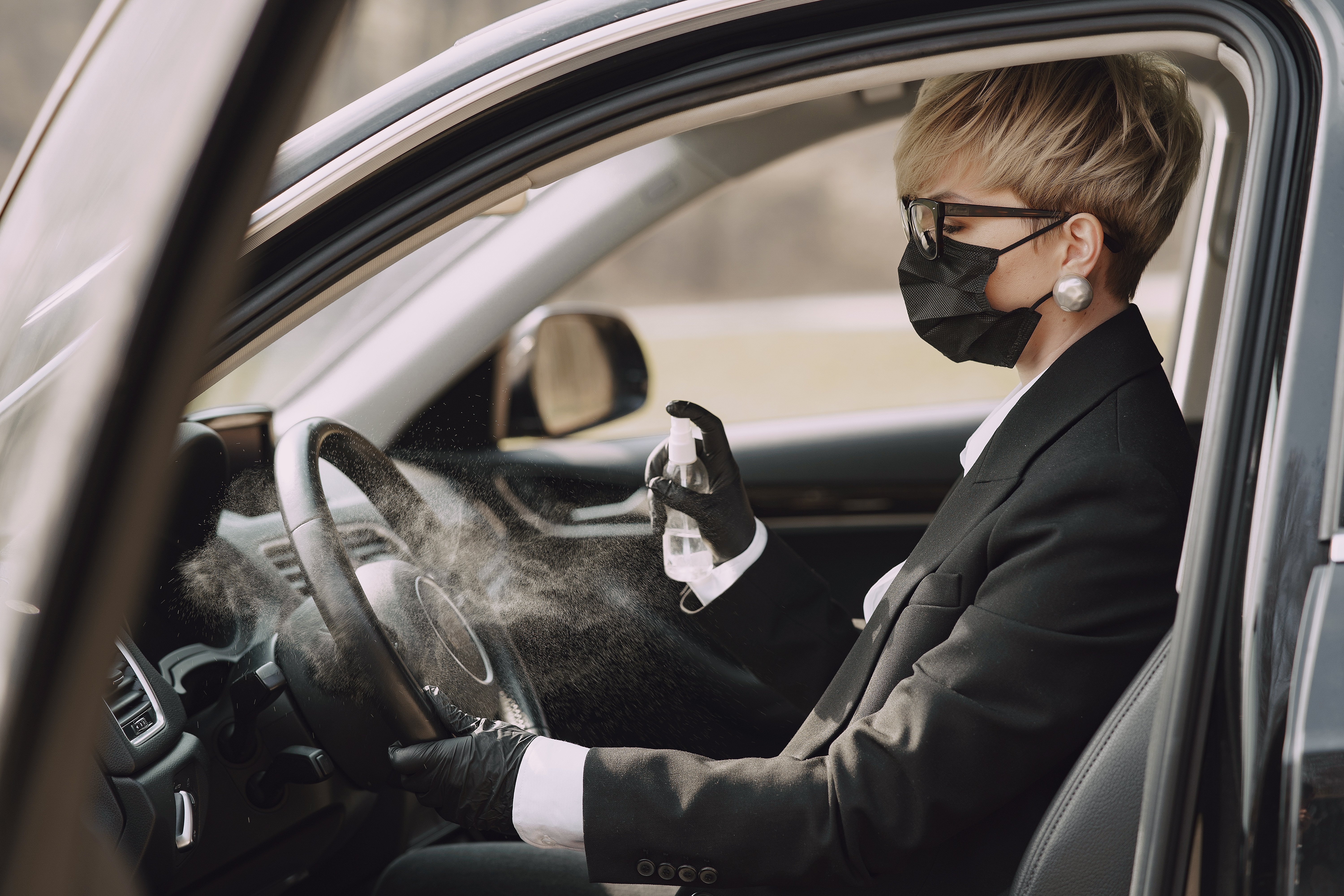 businesswoman-black-mask-sitting-inside-car