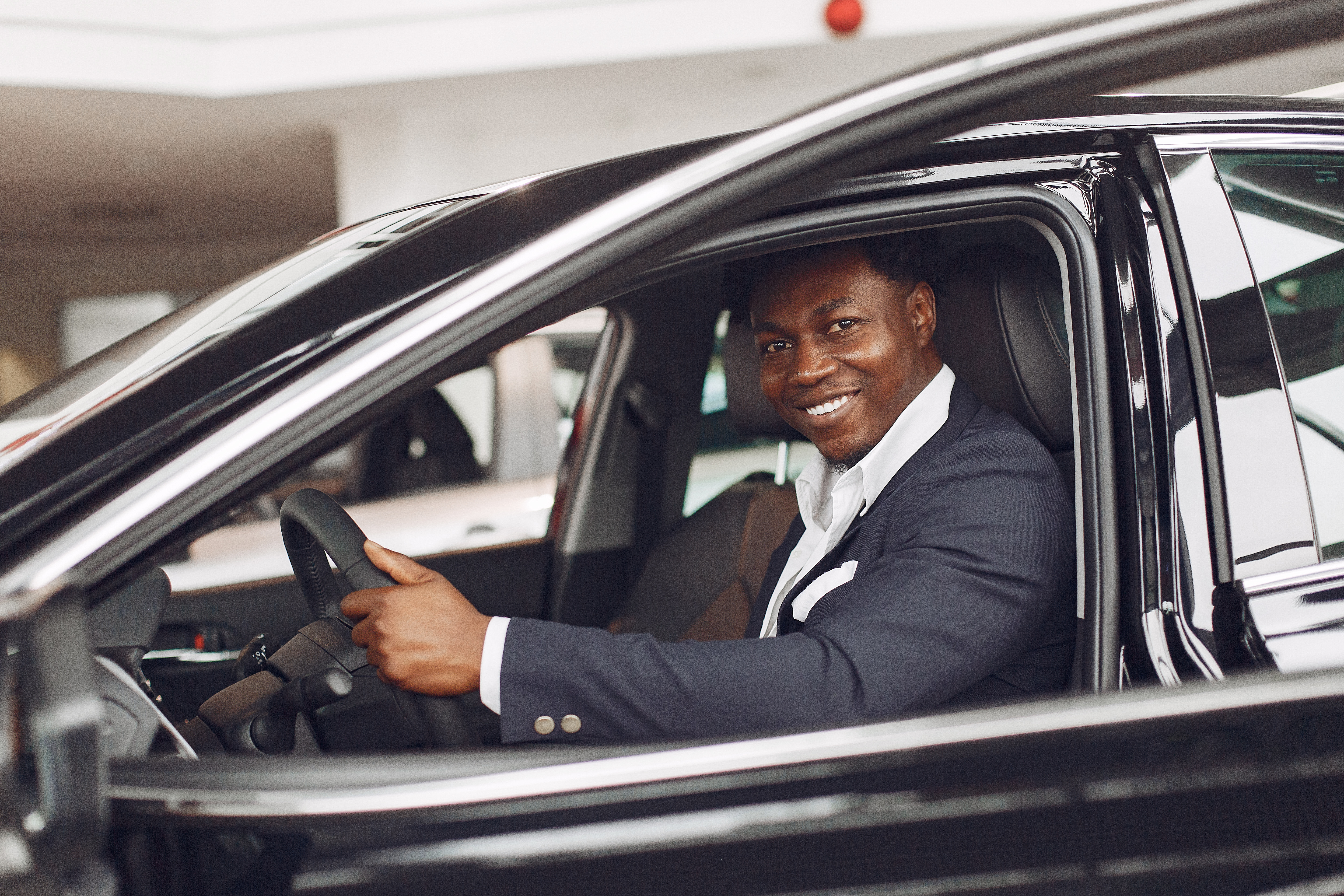 handsome-elegant-man-car-salon